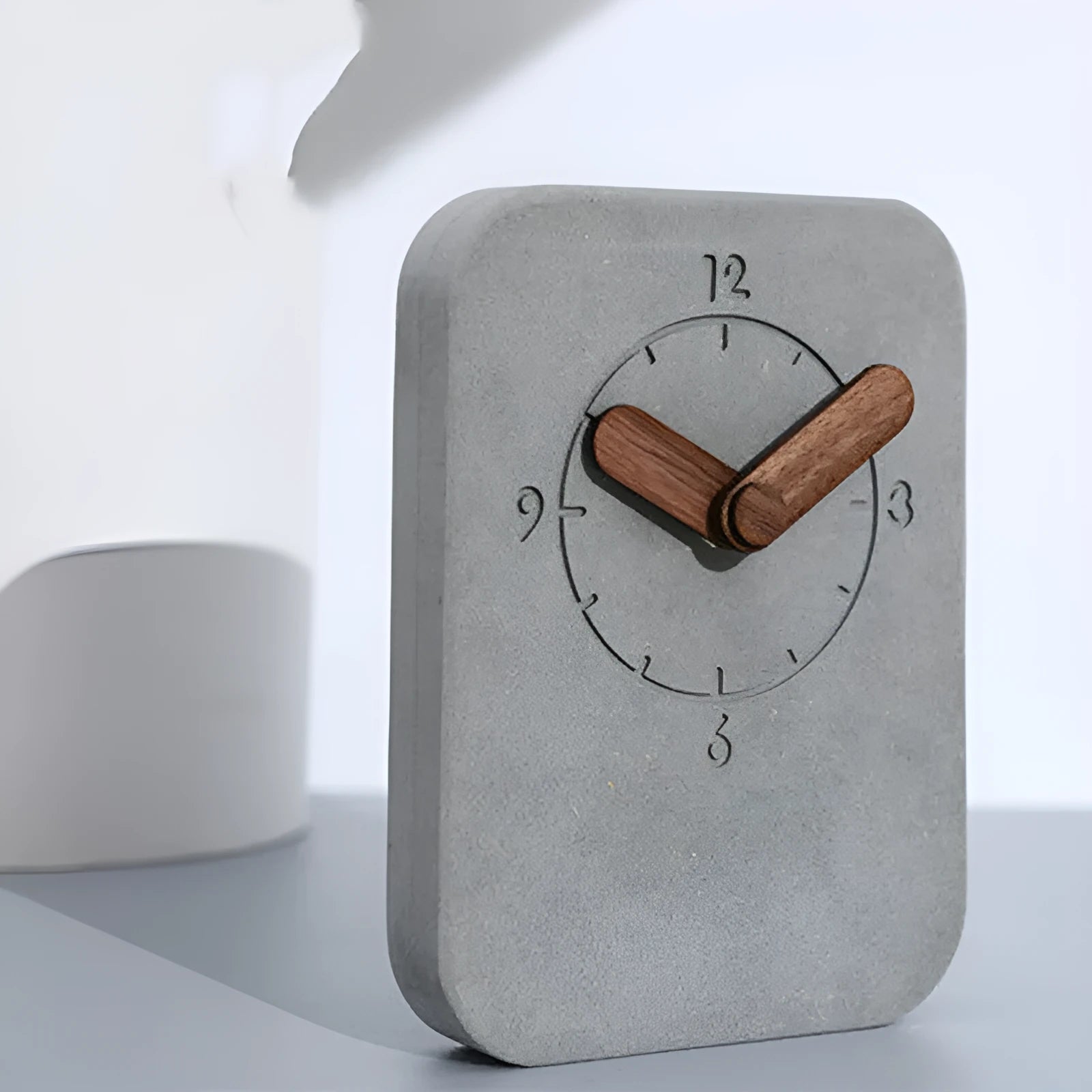 Gray Nordic silent desktop clock with MDF body and walnut trim on a desk surface