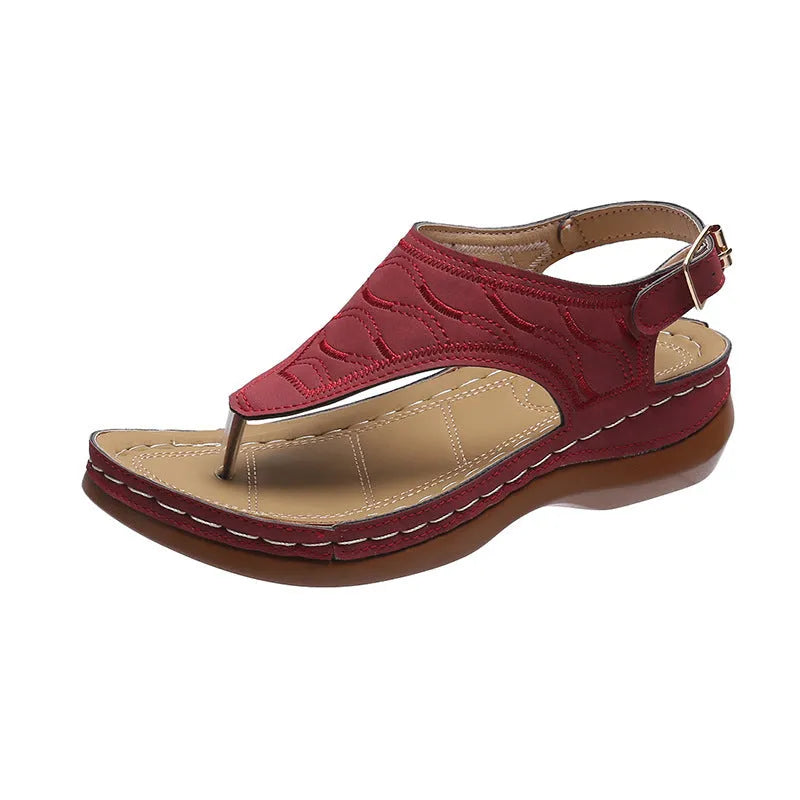 Women's wedge heel casual sandals in red with an adjustable back strap and flip-flop style.