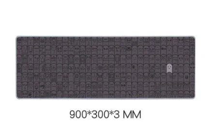 Grey cloth computer mouse wrist rest pad shown on a desk next to a gaming mouse.
