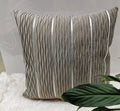 Soft striped velvet pillow cover for a sofa cushion in silver grey colour, shown on a chair.