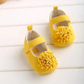 Soft sole toddler shoes with cotton upper and flower detail in yellow, red, pink or apricot, sizes 11cm to 13cm