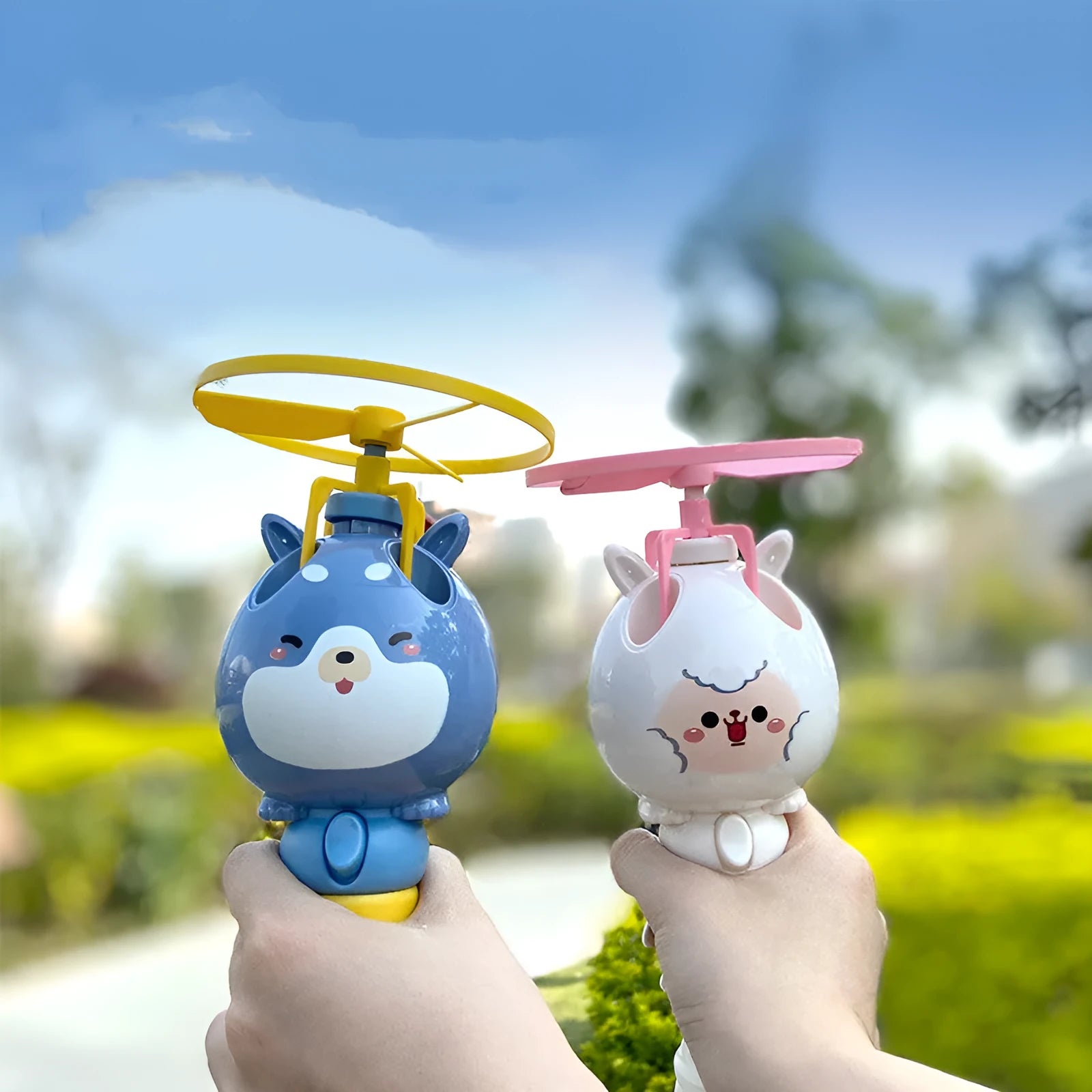 Bamboo Dragonfly rotating flying bubble machine in blue, hand-held with music and lights for outdoor play