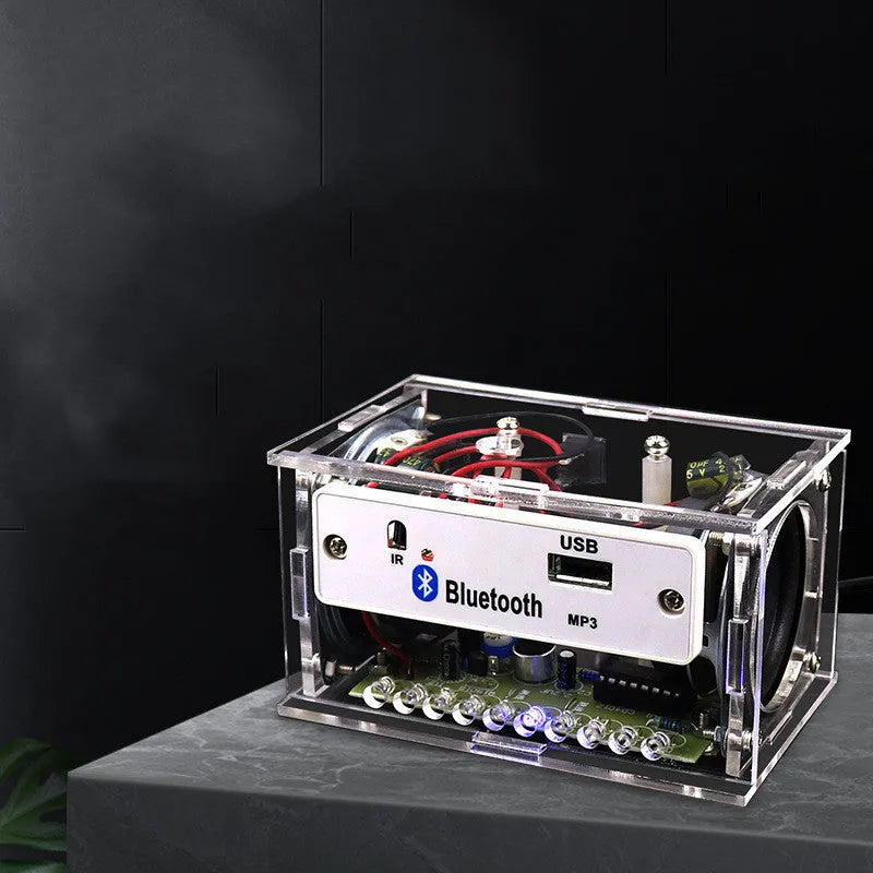 Bluetooth speaker DIY electronic kit with transparent housing and loose components for assembly