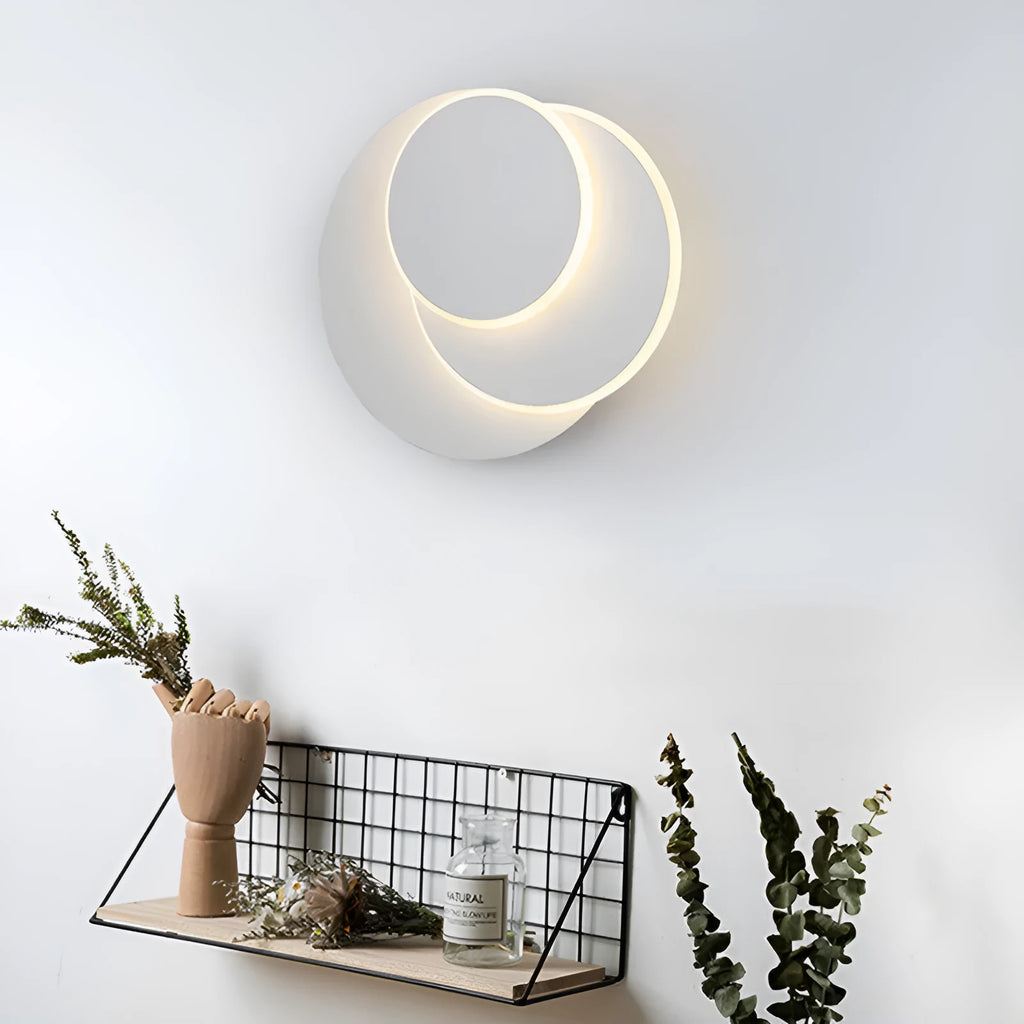 Modern round acrylic LED wall lamp in black or white, shown in three size options.