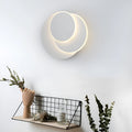Modern round acrylic LED wall lamp in black or white, shown in three size options.