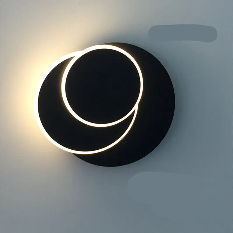 Modern round acrylic wall lamp in black or white, shown in small, middle, and large sizes for bedroom or living room.