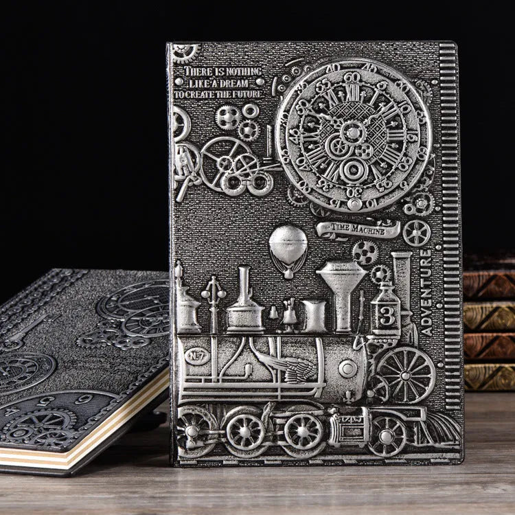 European relief embossed design on a metallic leather notepad cover, shown in green bronze, with dimensions 21.5 by 14.5 cm.