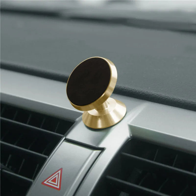 Universal magnetic car phone holder on dashboard showing black, silver, gold colour options