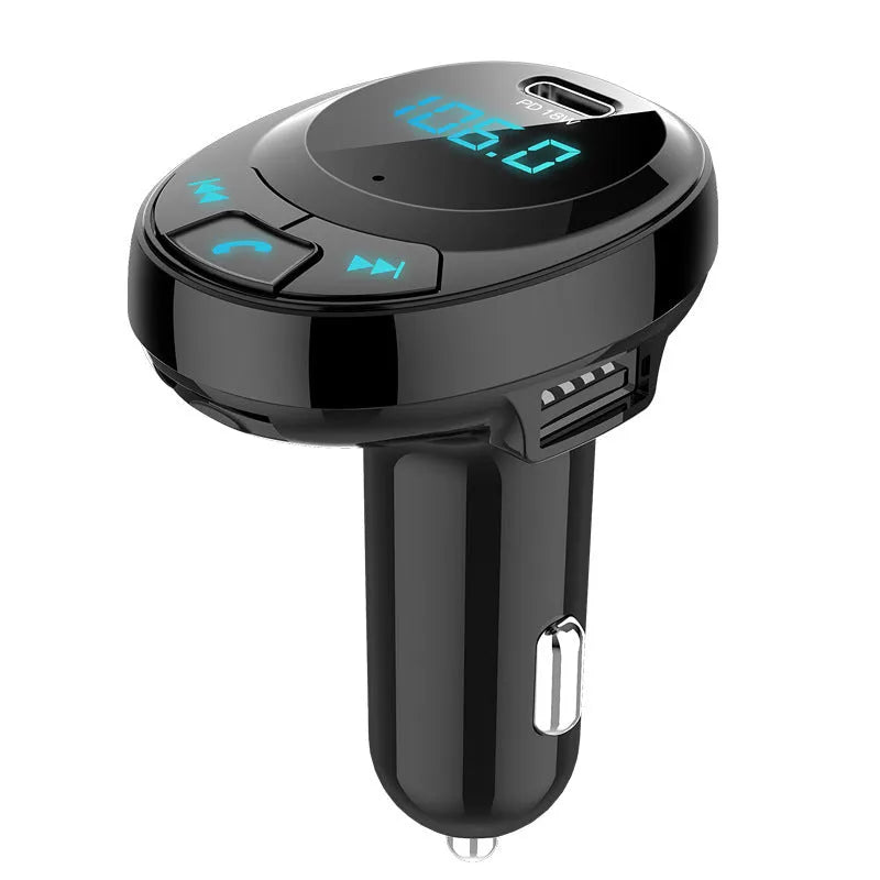 Compact black car Bluetooth MP3 player and dual USB charger with digital monochrome screen.
