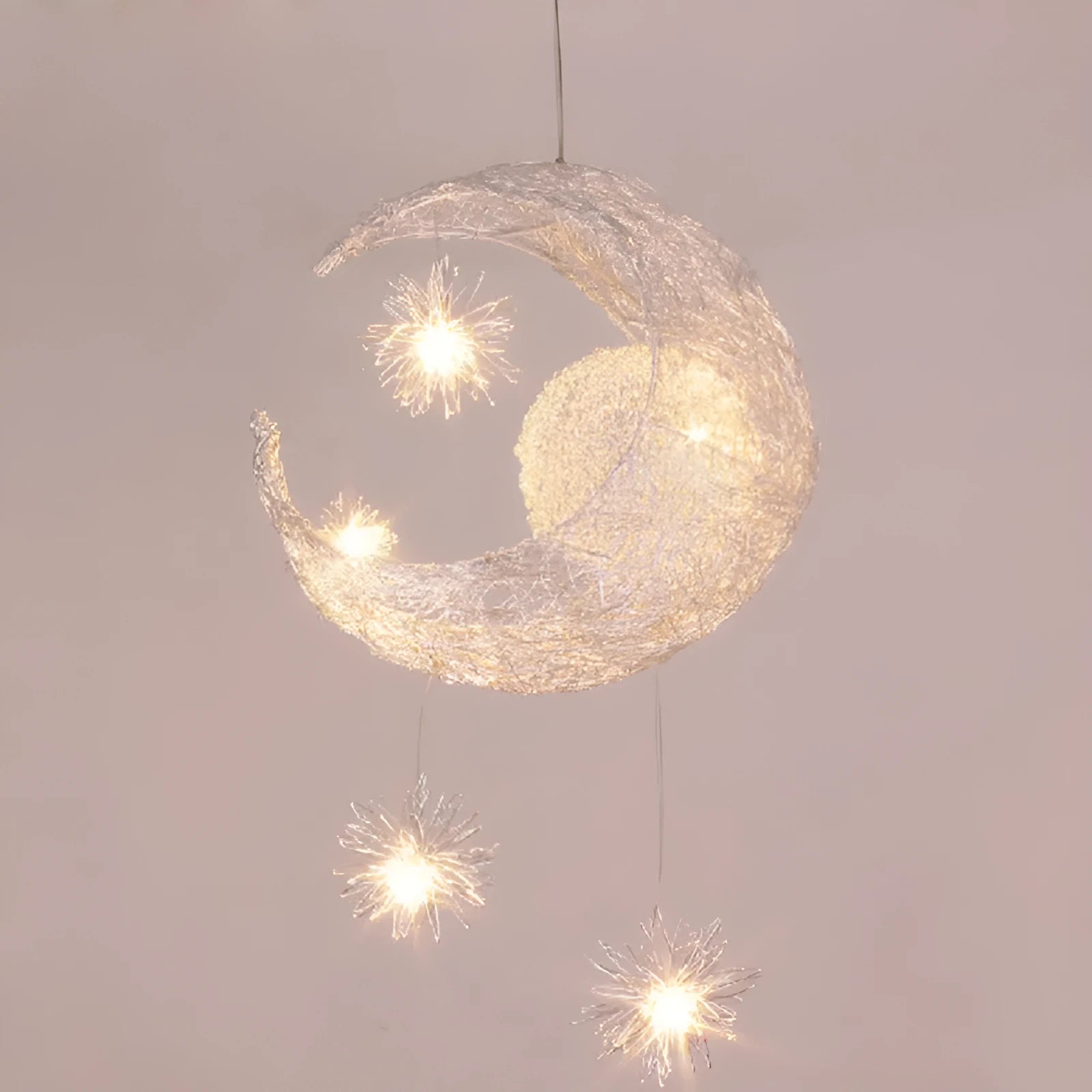 Zinc alloy chandelier with aluminium wire shade hanging from a ceiling, showing height adjustment.