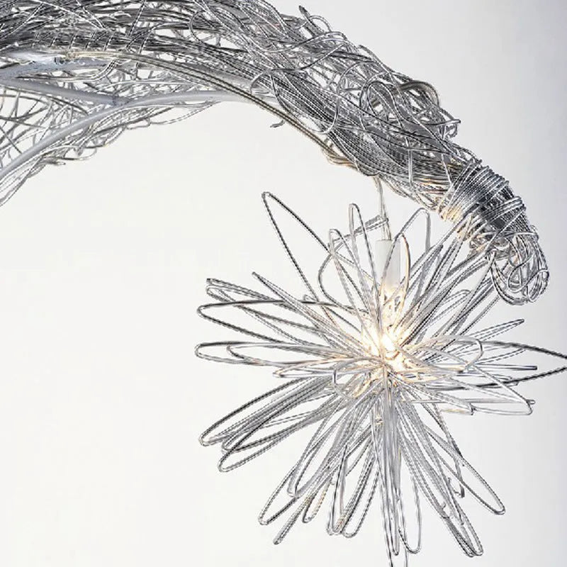 Zinc alloy chandelier with aluminium wire shade hanging from a ceiling, showing height adjustment.
