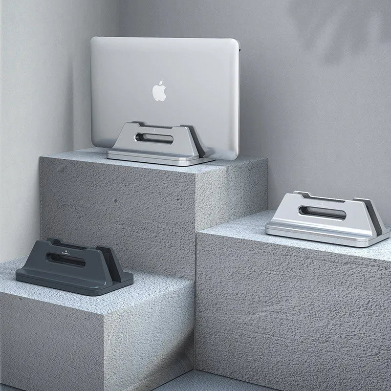 Silver aluminium alloy vertical notebook storage bracket measuring 16.5cm x 10cm x 6cm for 15-30mm laptops