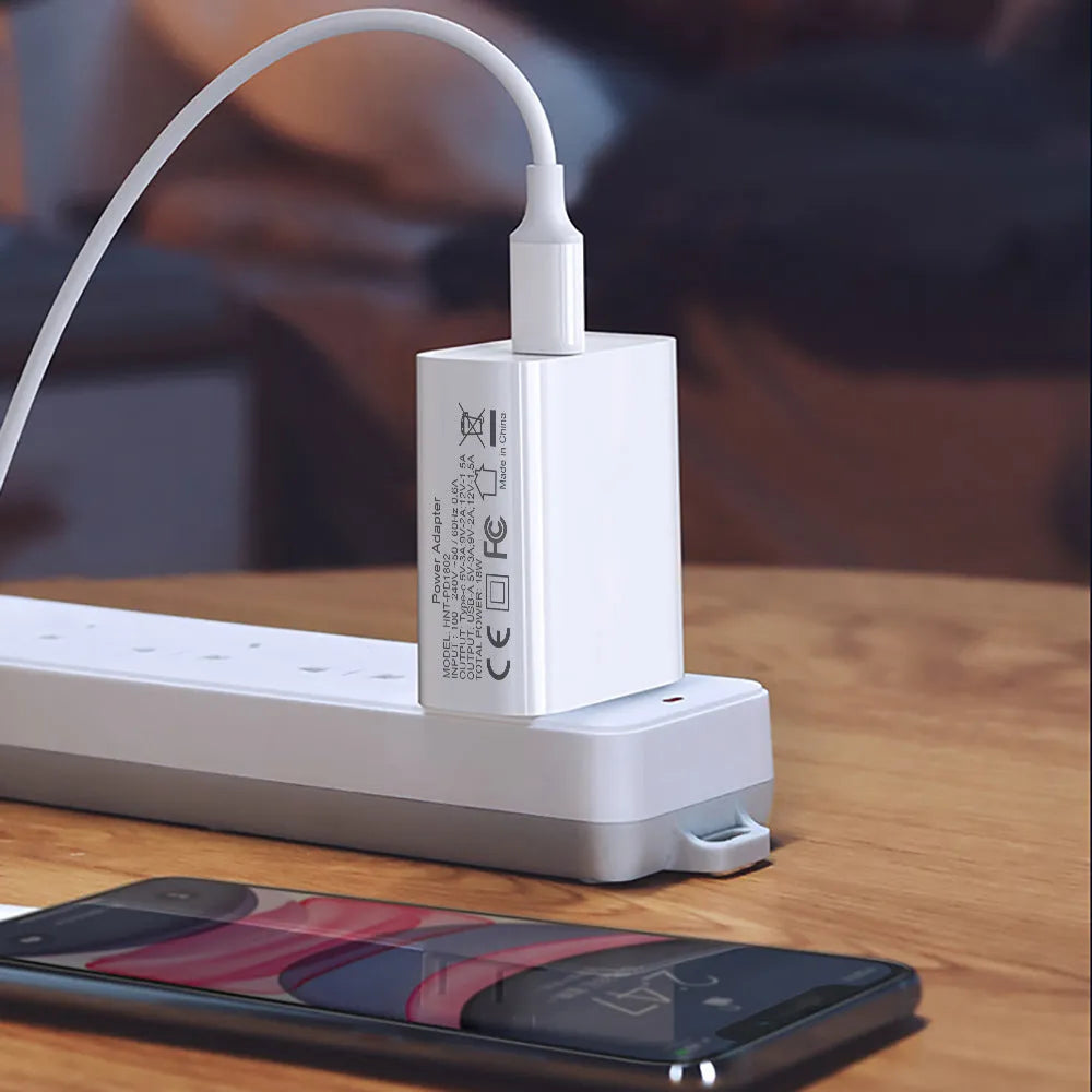 White 18W PD fast charger with dual USB-C ports for Apple iPhone 12 smartphones