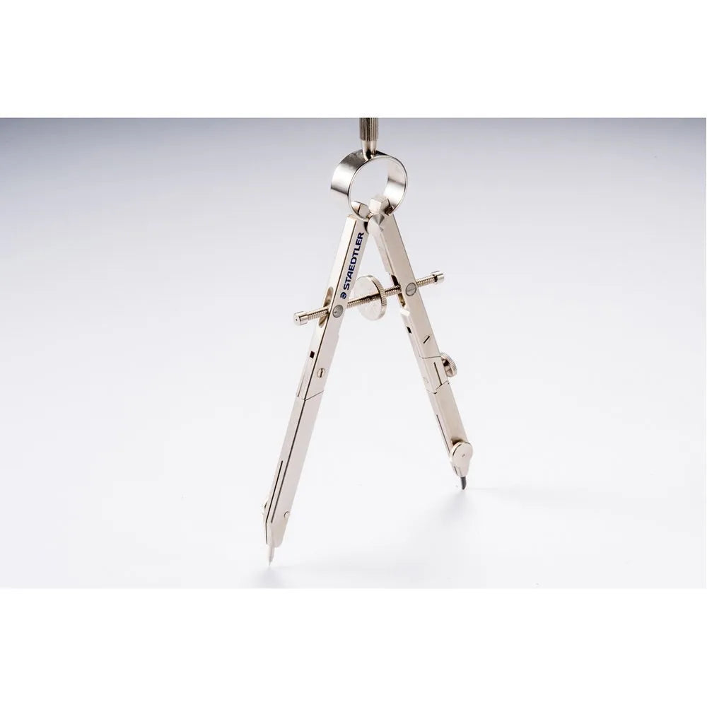 Staedtler 551 01 steel technical compass with telescopic centre rod and 12V car plug on a blueprint.