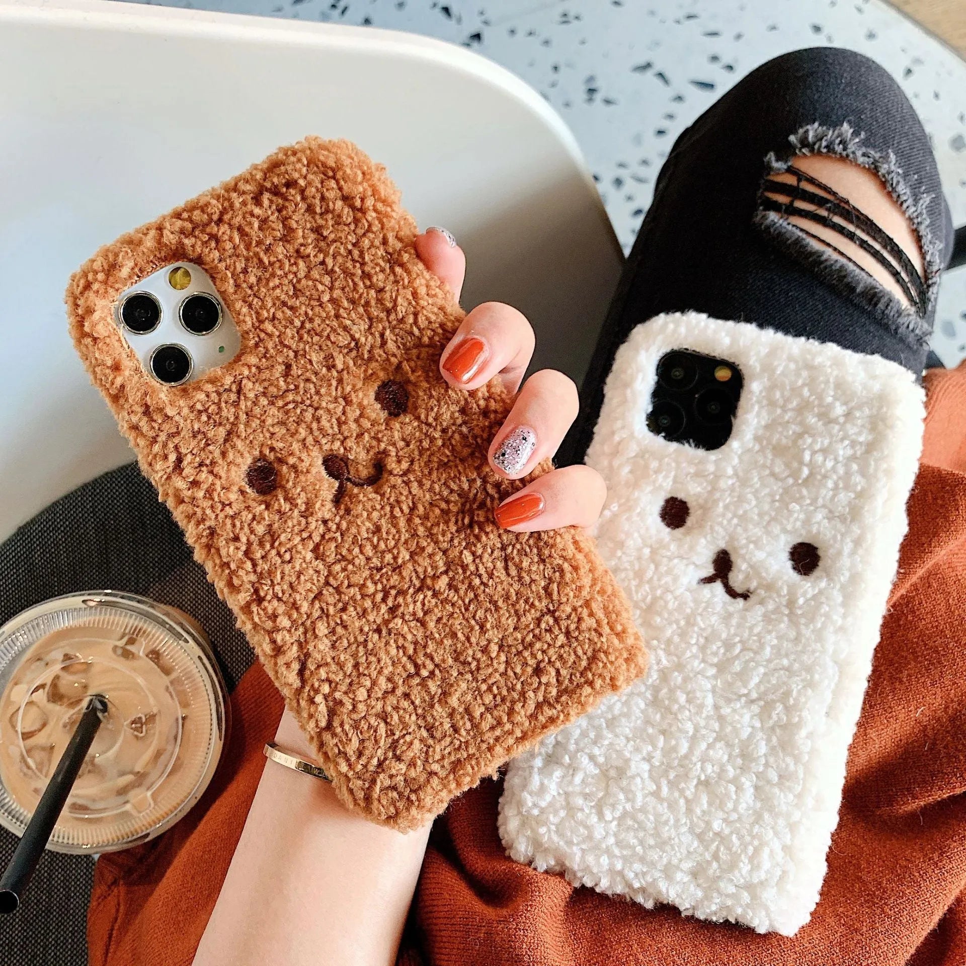 Brown embroidered plush bear face on a clear TPU iPhone case for iPhone 11
