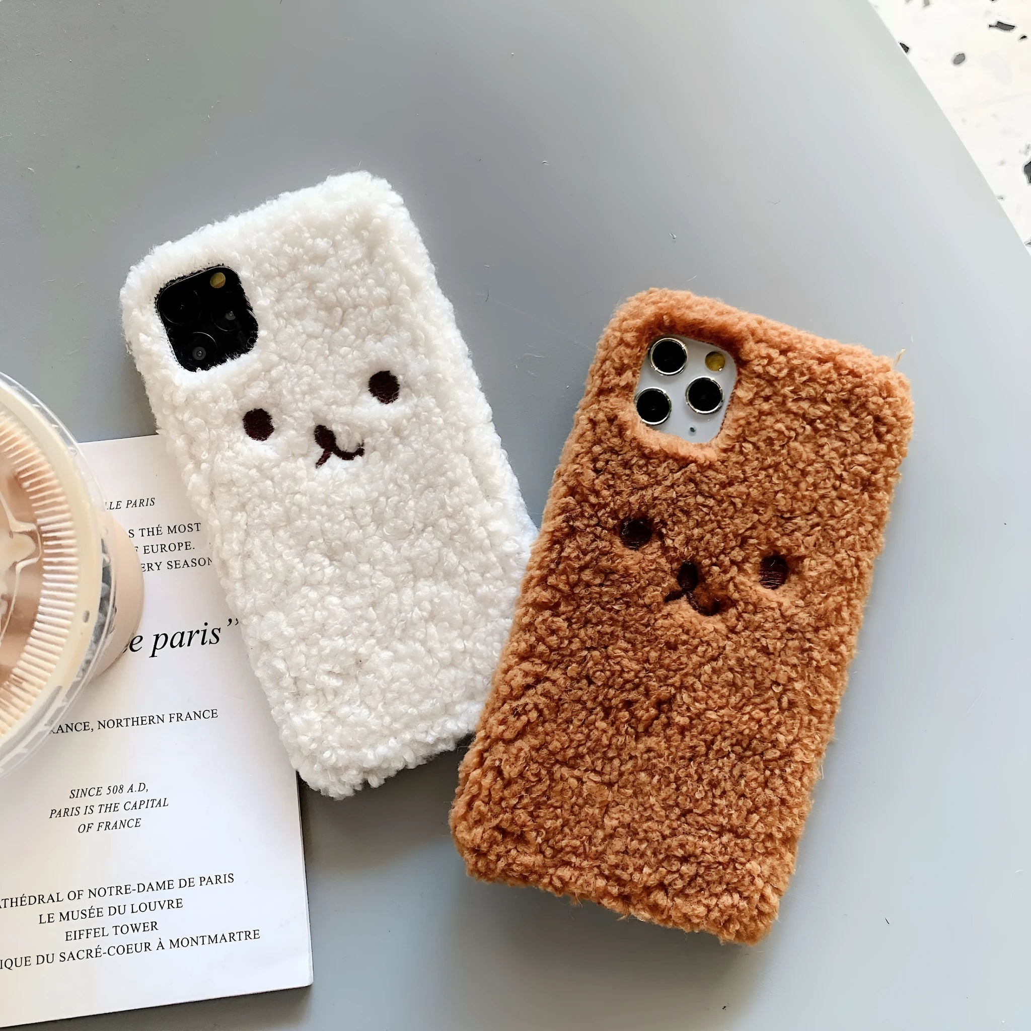 Brown embroidered plush bear face on a clear TPU iPhone case for iPhone 11
