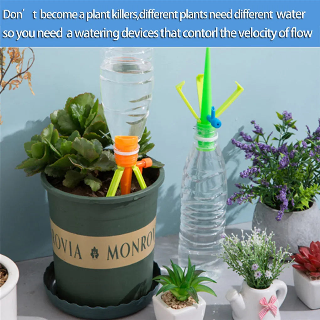 Ten plastic watering spikes 16.5cm long in green and orange for bottle-based garden irrigation