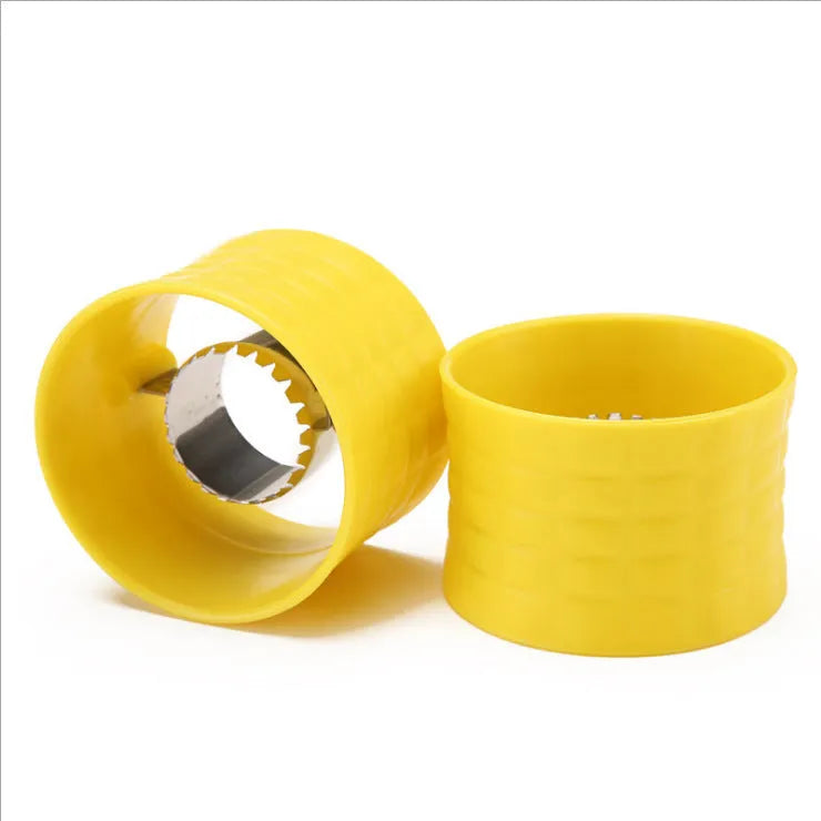 Yellow manual corn grinder thresher with corn-shaped design on a kitchen counter.