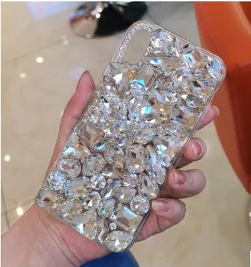 Clear iPhone case with crystal rhinestone decoration on the back, shown in green colour.