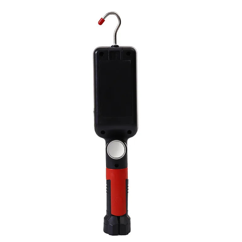 Red portable COB LED work light with magnet base and hook, showing USB charging port.