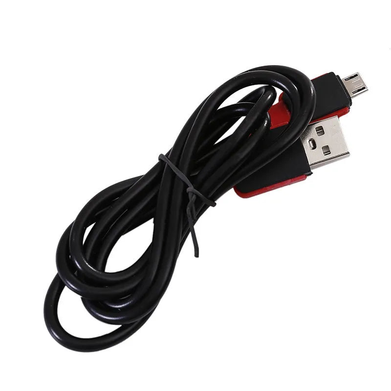 Red portable COB LED work light with magnet base and hook, showing USB charging port.