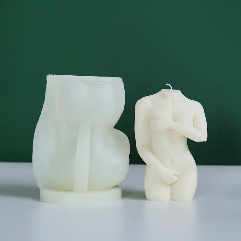 Silicone mould showing detailed shy female body shape for making candles or cakes.