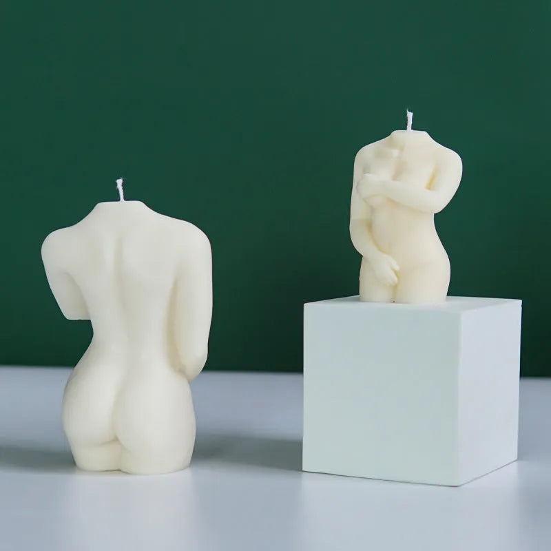 Silicone mould showing detailed shy female body shape for making candles or cakes.