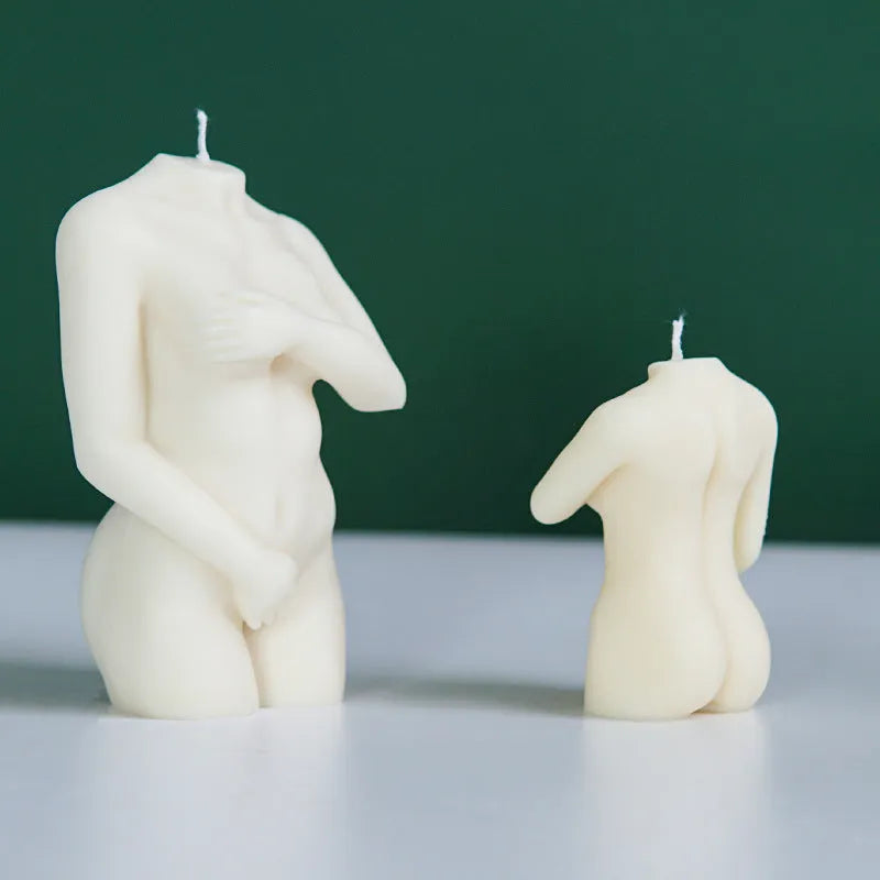 Silicone mould showing detailed shy female body shape for making candles or cakes.