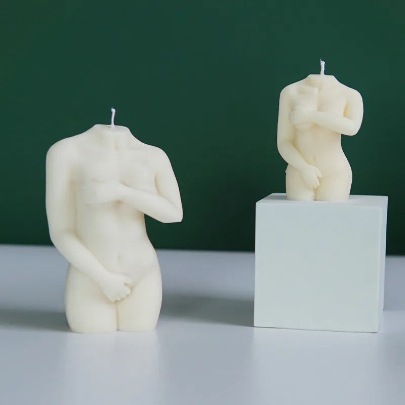 Silicone mould showing detailed shy female body shape for making candles or cakes.
