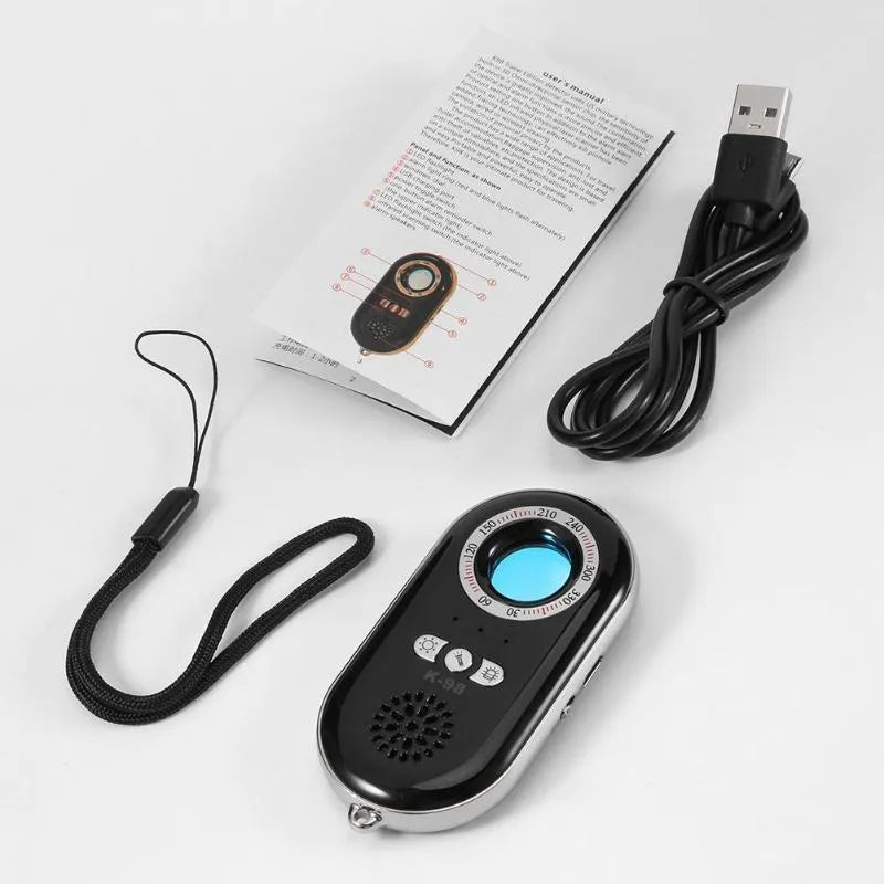 Compact black wireless signal detector with vibration sensor for anti-theft alarms.