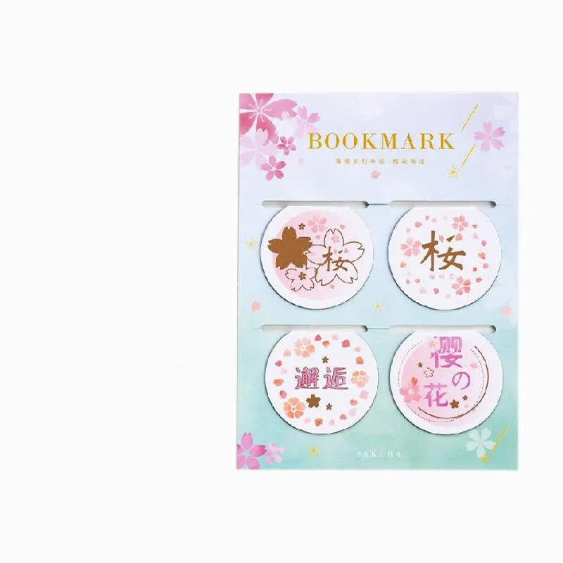 Set of four Yanji magnetic bookmarks with different cherry blossom designs on stone paper.