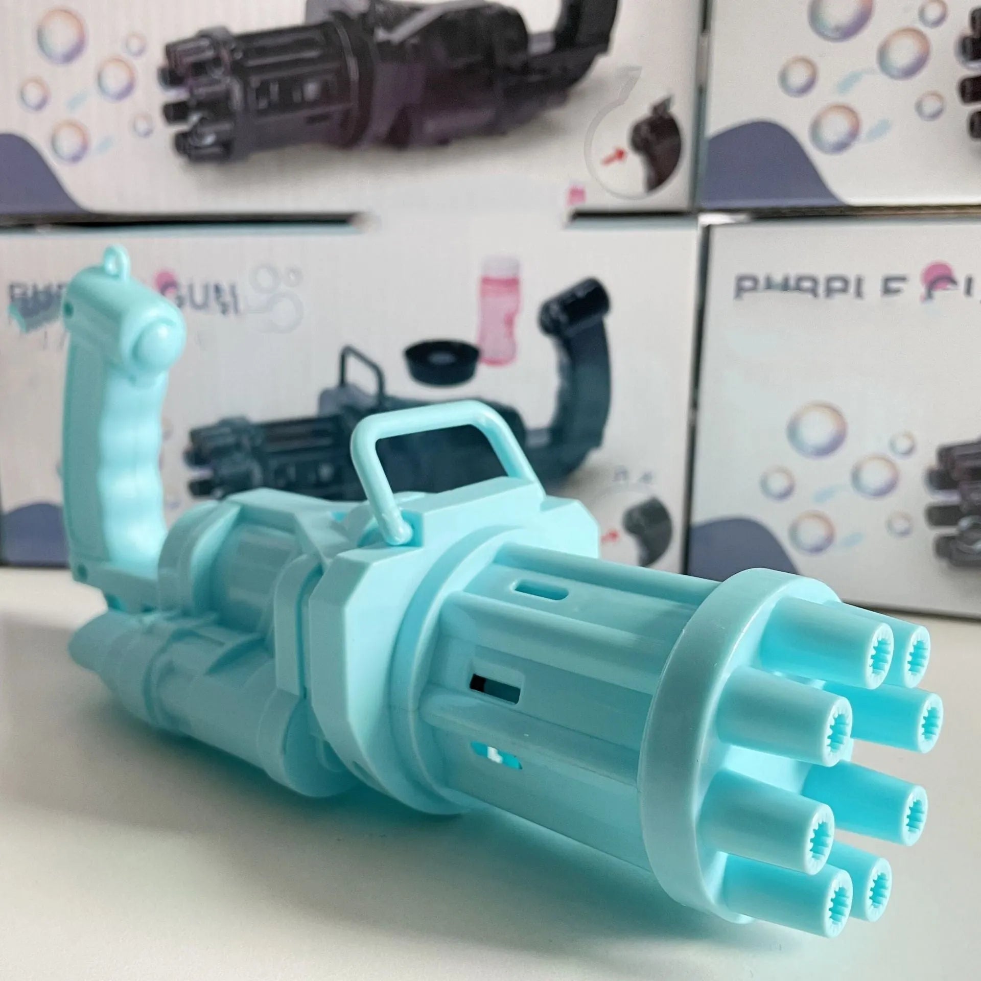 Children's bubble machine toy with machine gun design in pink, gold, or black colours