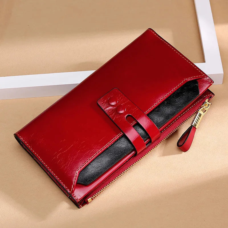 Women's oil wax leather wallet handbag with buckle closure showing internal card slots and compartments