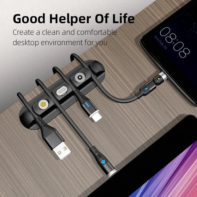 Black soft plastic desktop organiser for holding data and magnetic charging cables.