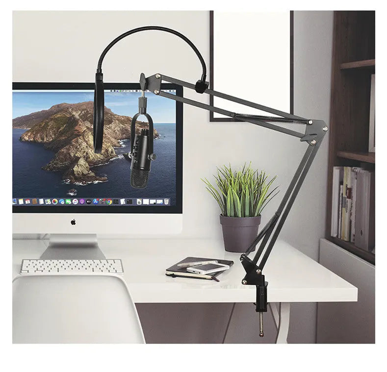 Black BM-86PRO USB condenser microphone on a metal stand with foam cover and cable.