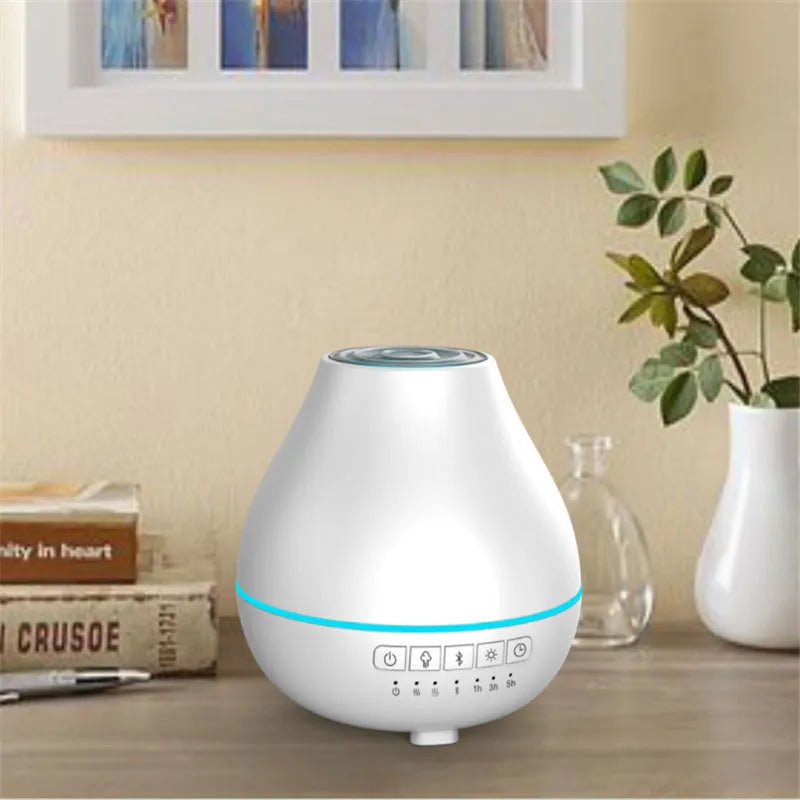 White round Bluetooth aroma diffuser and humidifier with night light on a wooden table