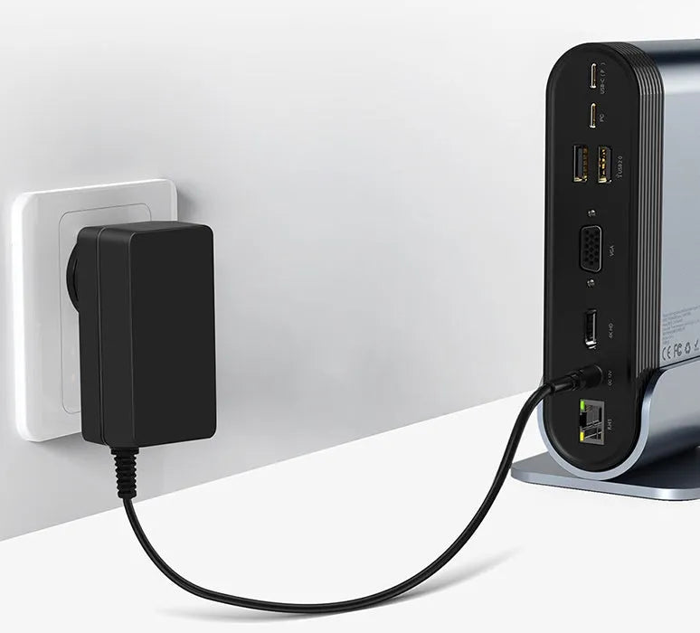 Deep space grey 16-in-1 USB-C docking station and power supply on a desk.
