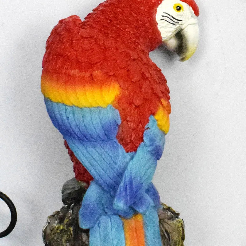 Hand-painted resin parrot solar light in blue with LED illumination for garden lawn decoration