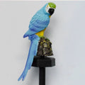Hand-painted resin parrot solar light in blue with LED illumination for garden lawn decoration