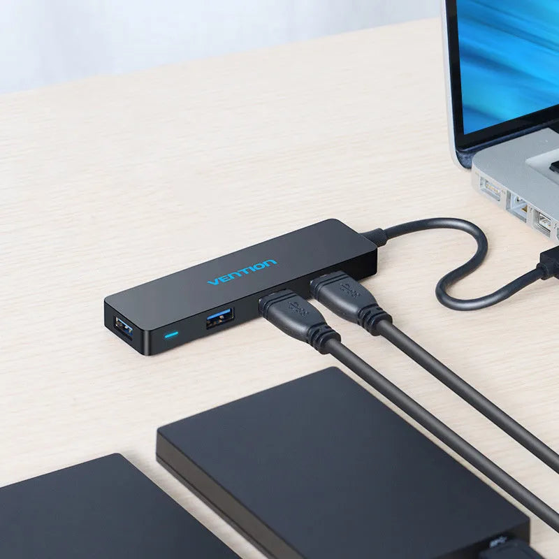 Black USB 3.0 four-port hub with 0.15 m cable and nickel-plated ports