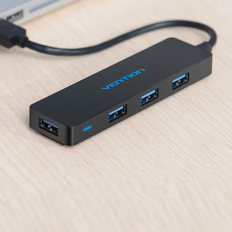 Black USB 3.0 four-port hub with 0.15 m cable and nickel-plated ports