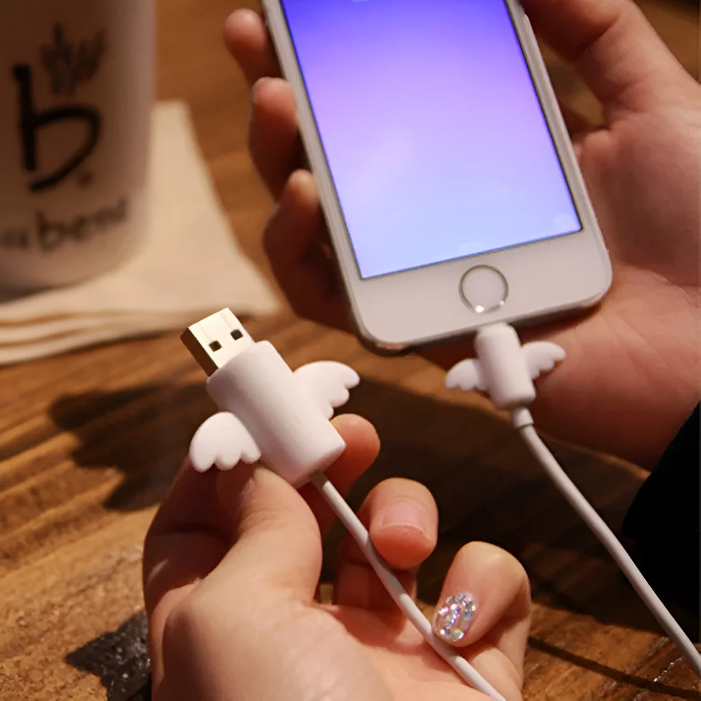 White and black silicone cable protective covers shown next to a charging cable.