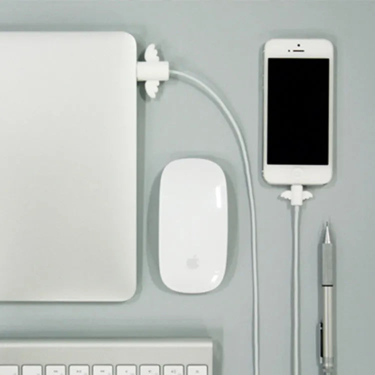 White and black silicone cable protective covers shown next to a charging cable.