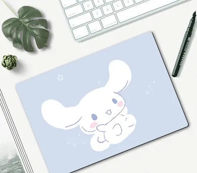 Small cartoon girl design mouse pad with wind-shaped edges on a desk