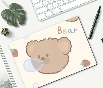 Small cartoon girl design mouse pad with wind-shaped edges on a desk