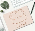 Small cartoon girl design mouse pad with wind-shaped edges on a desk