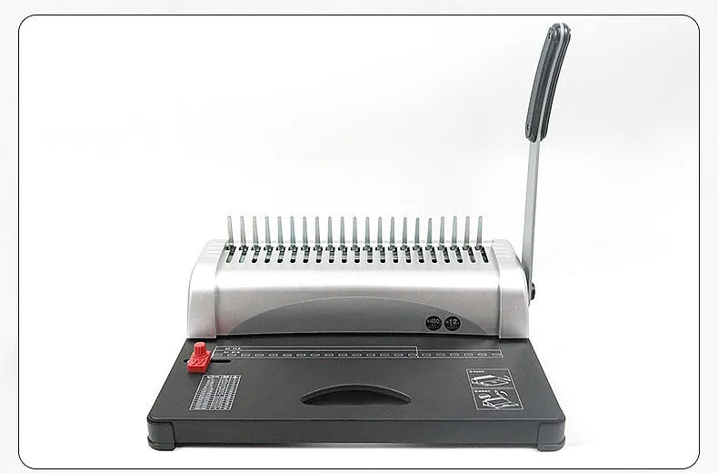 White manual A4 21-hole clamp strip binding machine on desk