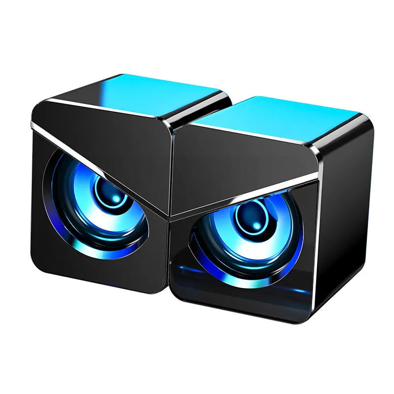Small black and white USB desktop computer speakers with dual plastic construction