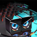 Small black and white USB desktop computer speakers with dual plastic construction
