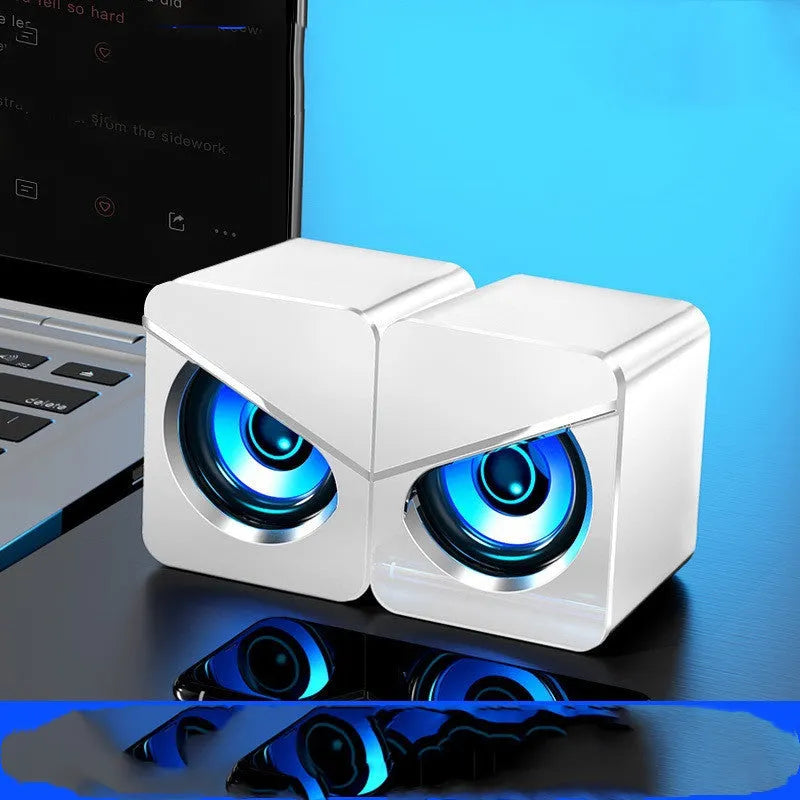 Small black and white USB desktop computer speakers with dual plastic construction